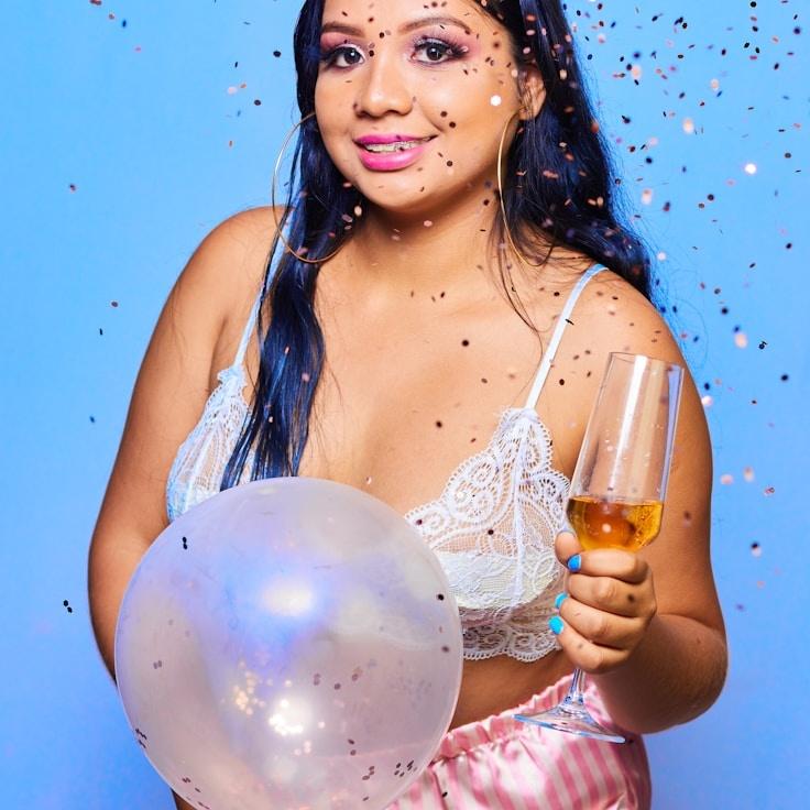 Kaveri Mehta, Lead Design Curator at SilentBridgeAtlas, reviewing corporate floral arrangements